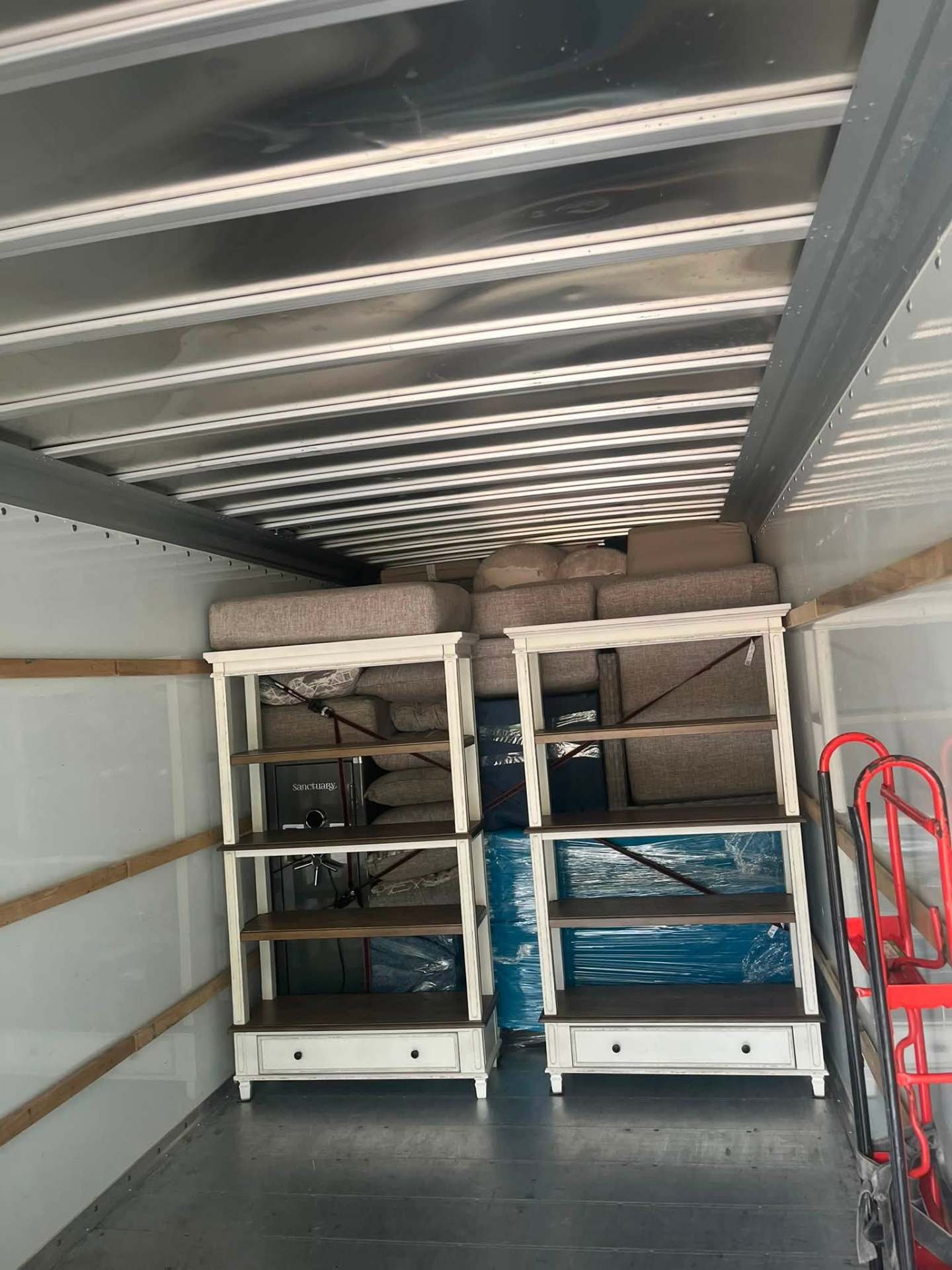Bookshelves and sofa cushions strapped in place