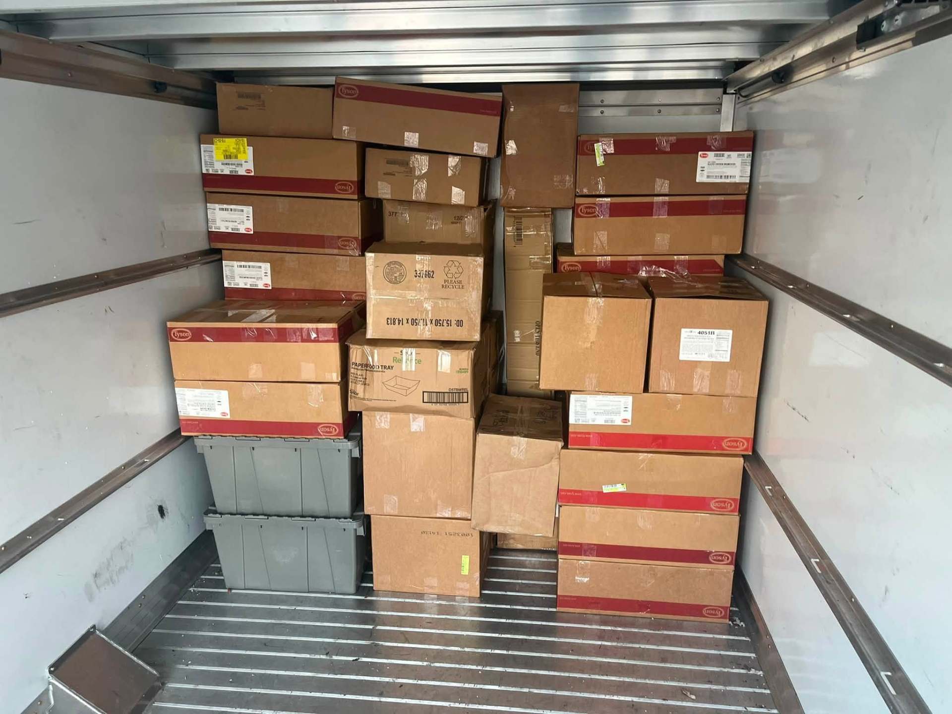 Neatly stacked boxes filling the truck bed