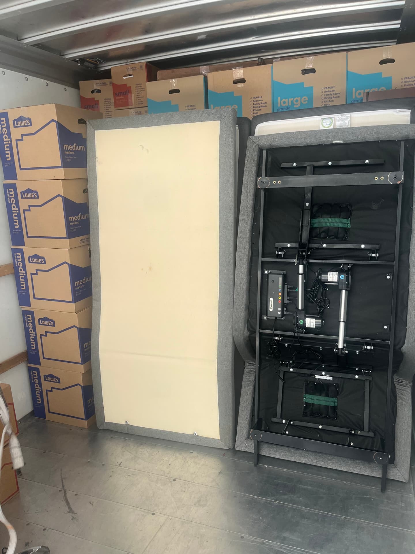 Adjustable bed base and headboard loaded upright in the truck