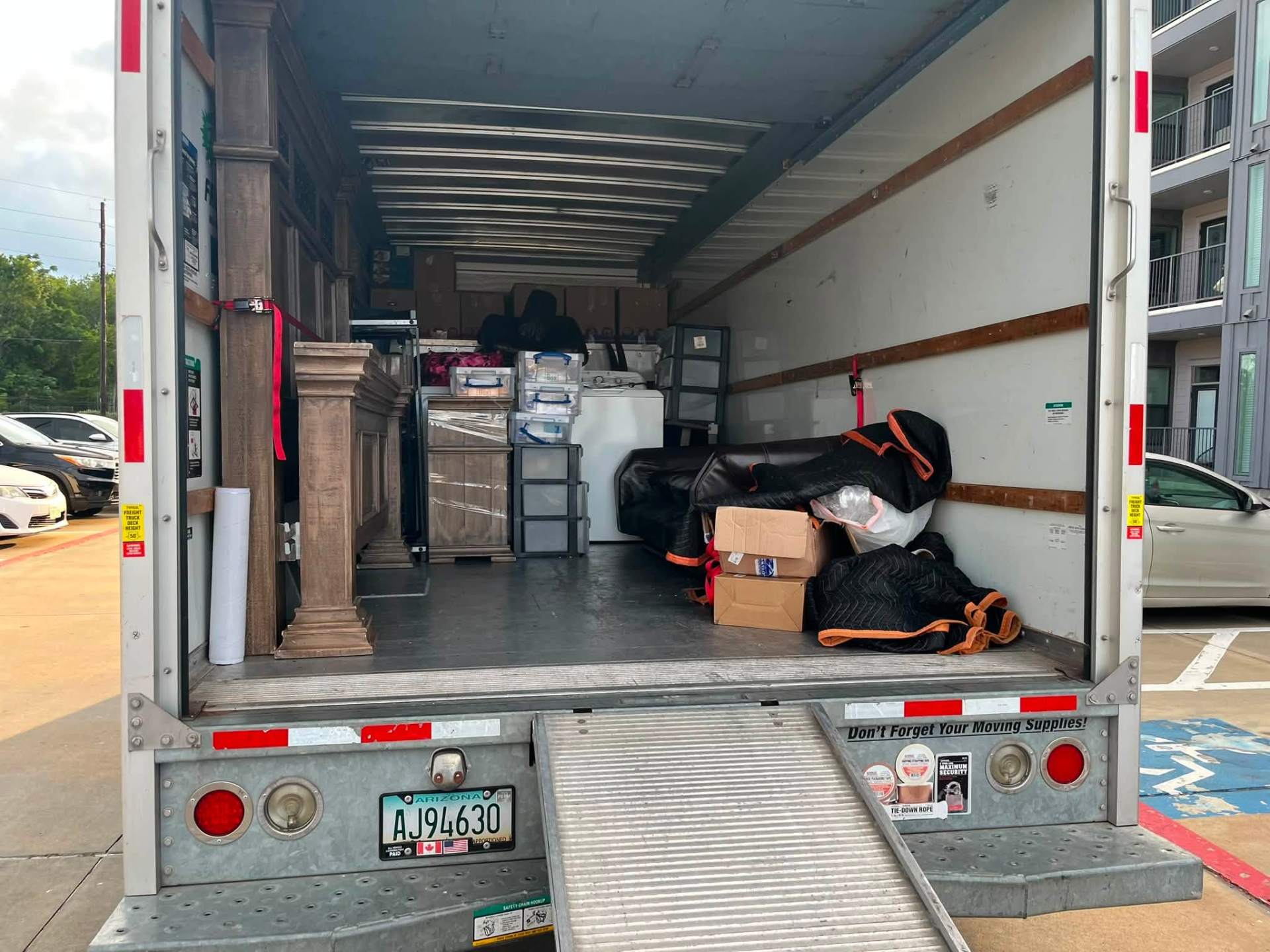 Loaded box truck with pillars and cabinetry ready for delivery