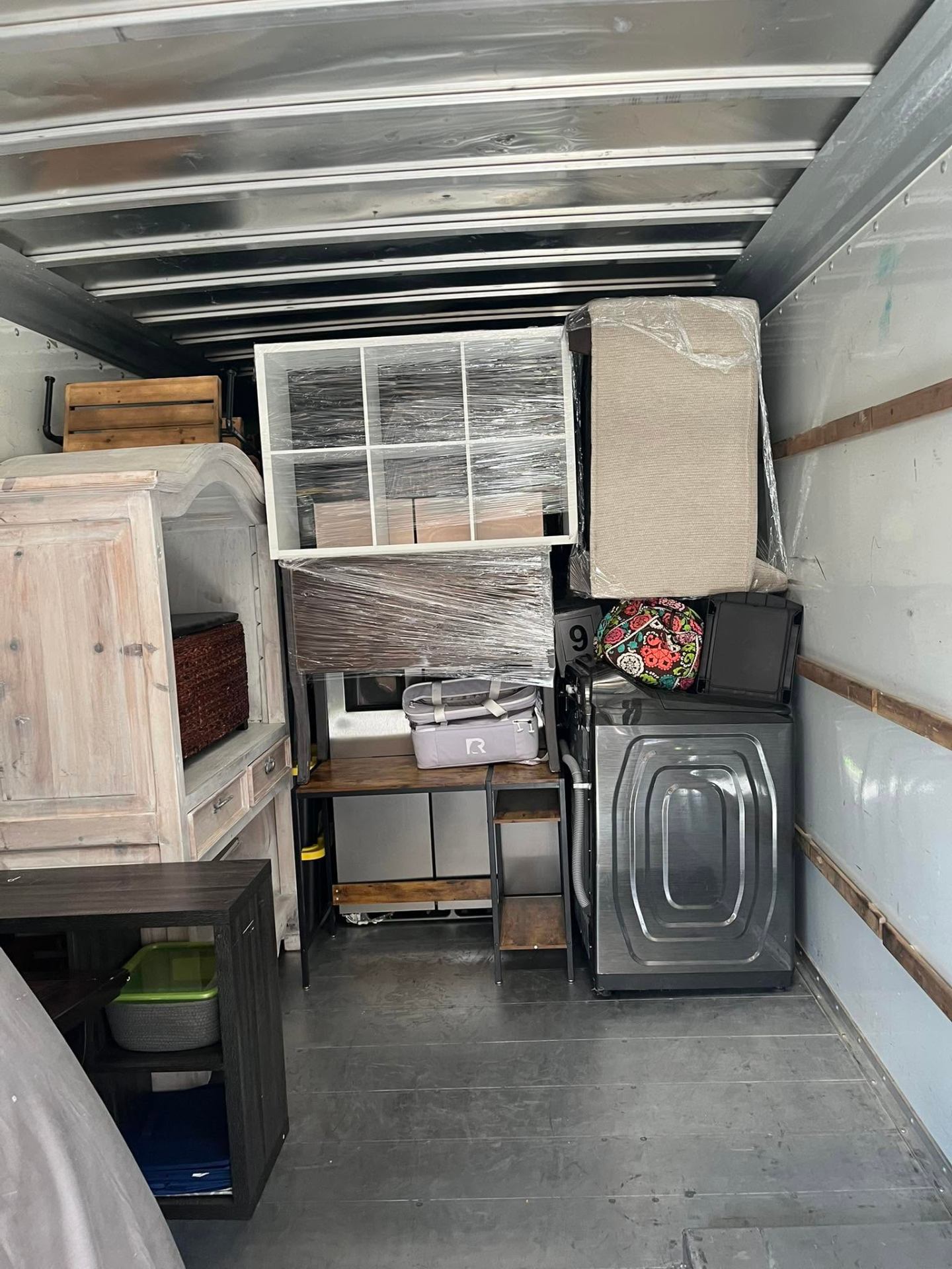Wrapped furniture and appliances loaded in the truck