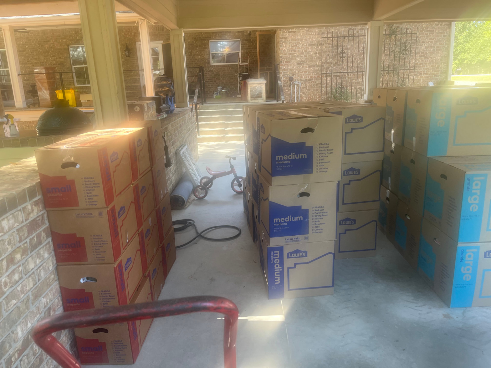 Stacked moving boxes ready for the truck at a Houston home